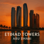 Etihad Towers Abu Dhabi saat matahari terbenam dengan tulisan Etihad Towers Abu Dhabi